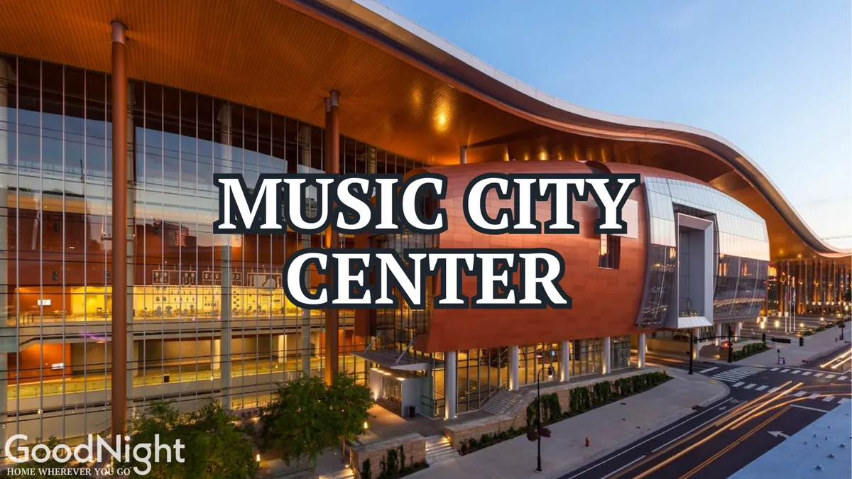 The exterior view of the Music City Center shows the building's sweeping curved roof, expansive glass windows, and modern architectural design. In front, people can be seen coming and going, suggesting an energetic environment ideal for conferences and business events.