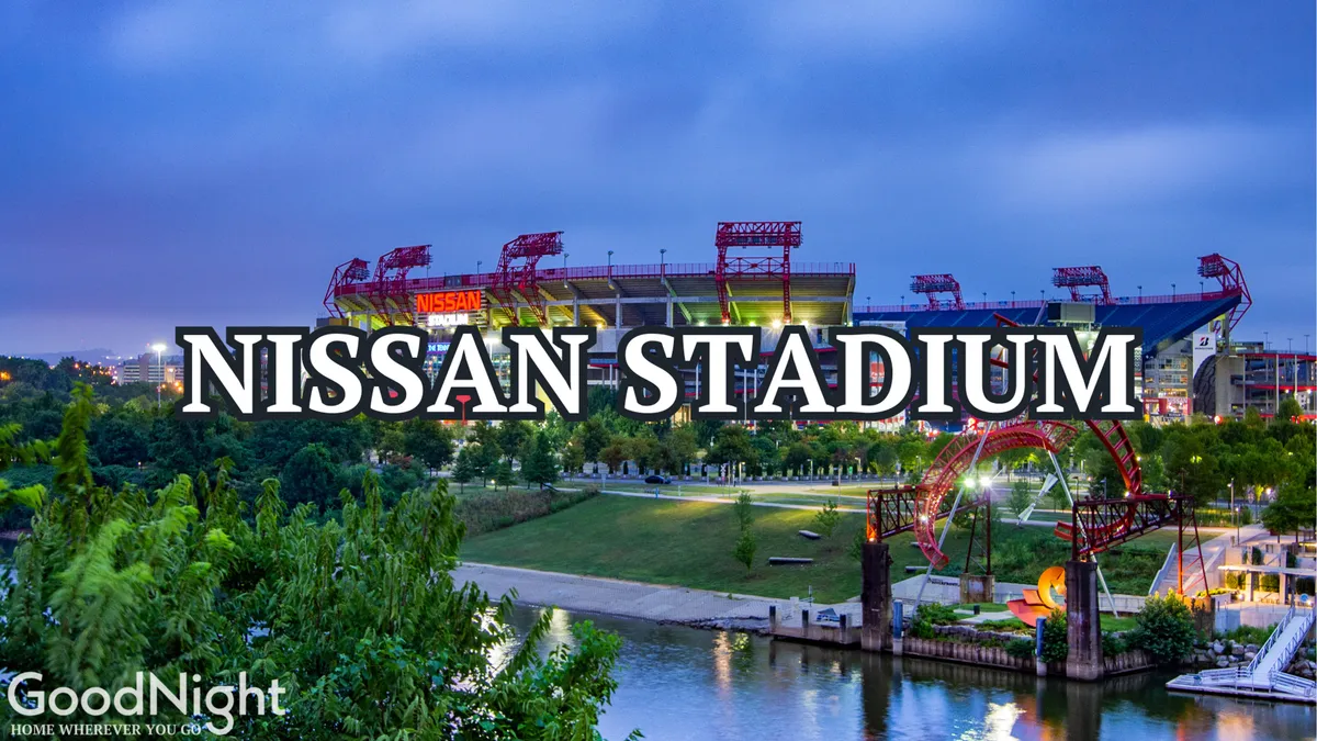 A broad view of Nissan Stadium overlooking a park area and adjacent river, capturing the excitement of game day crowds and the expanse of the venue under an energetic sky.