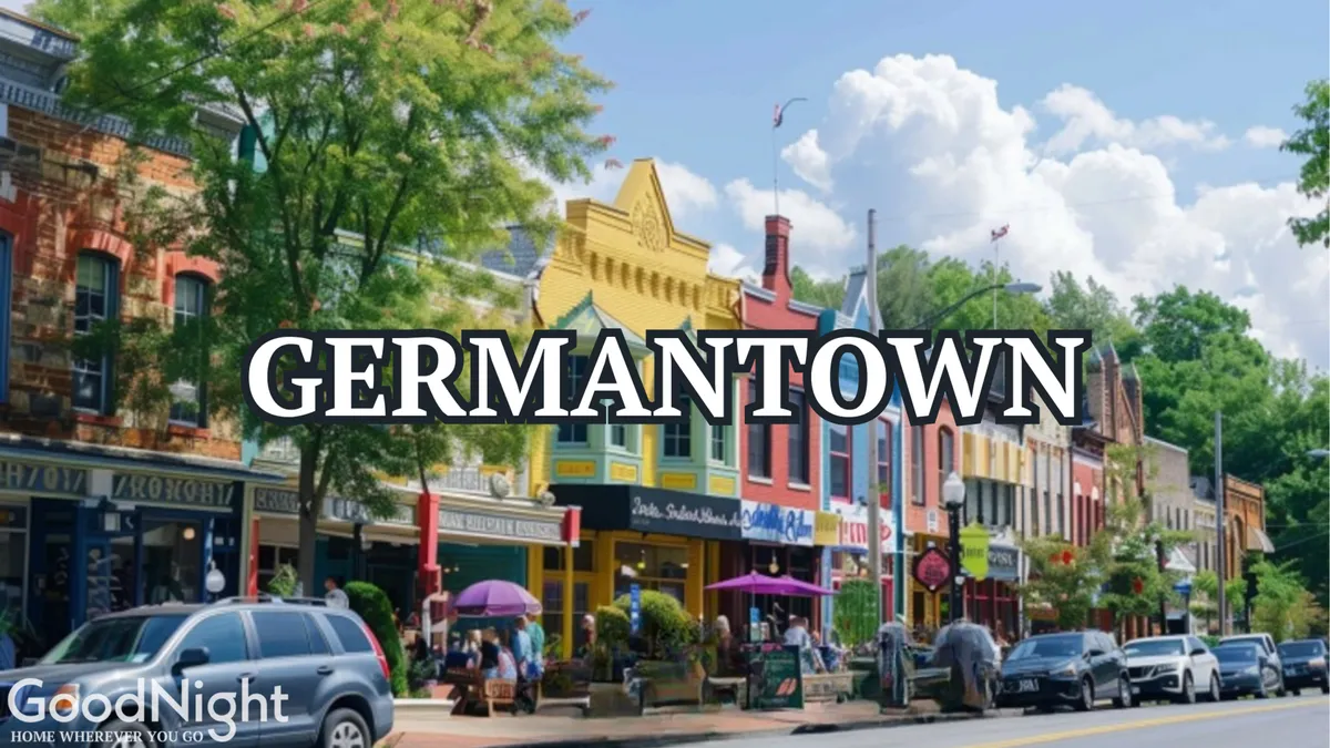 A lively Nashville street with colorful storefronts, mature trees, parked cars, and pedestrians strolling along the sidewalks. Outdoor seating at restaurants and a general sense of vibrancy depict an area bustling with activity and opportunities for team outings or informal networking.